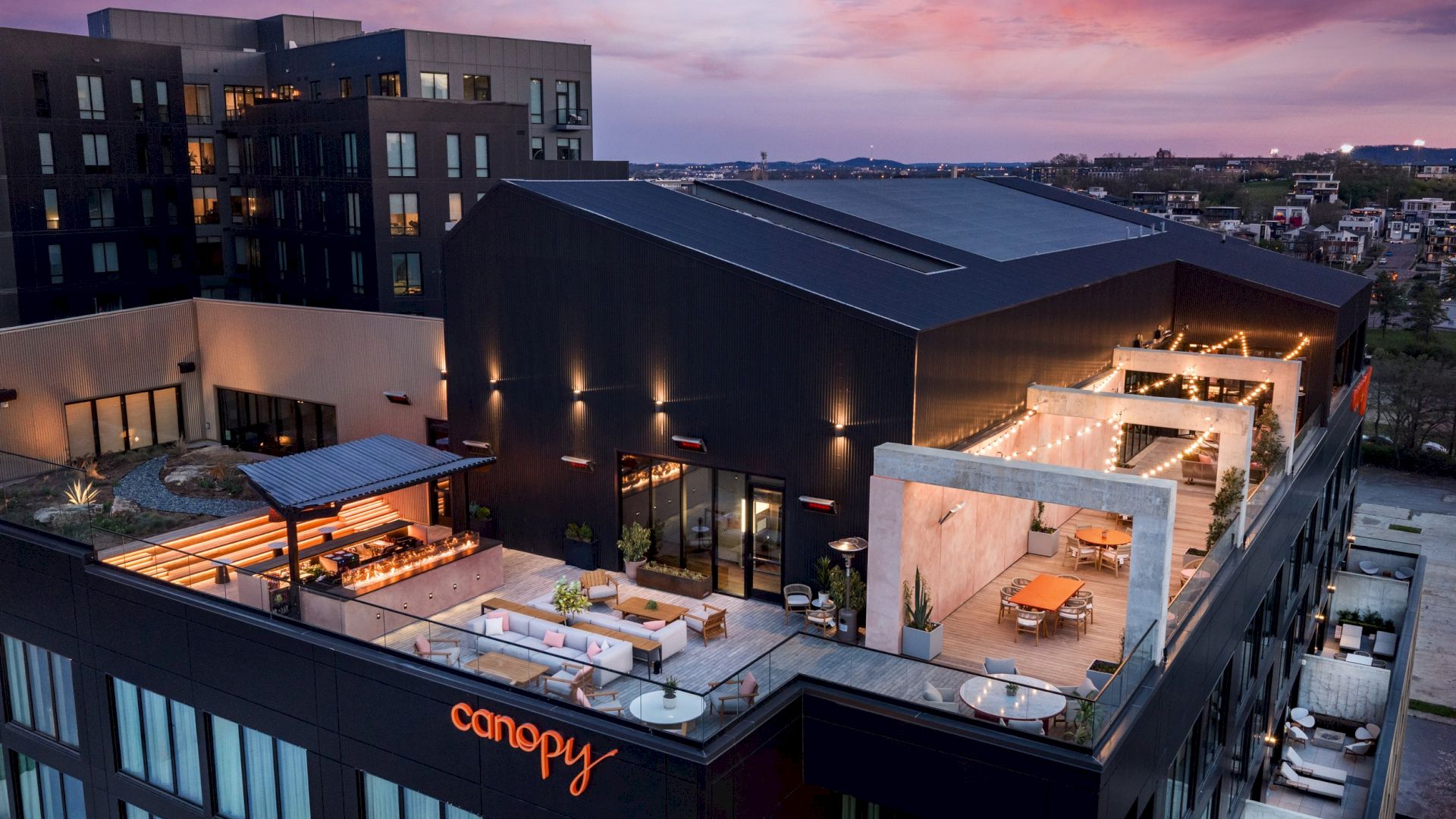Aerial view of the COA rooftop terrace in The Gulch at dusk