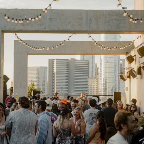 Crowd at a rooftop event at COA